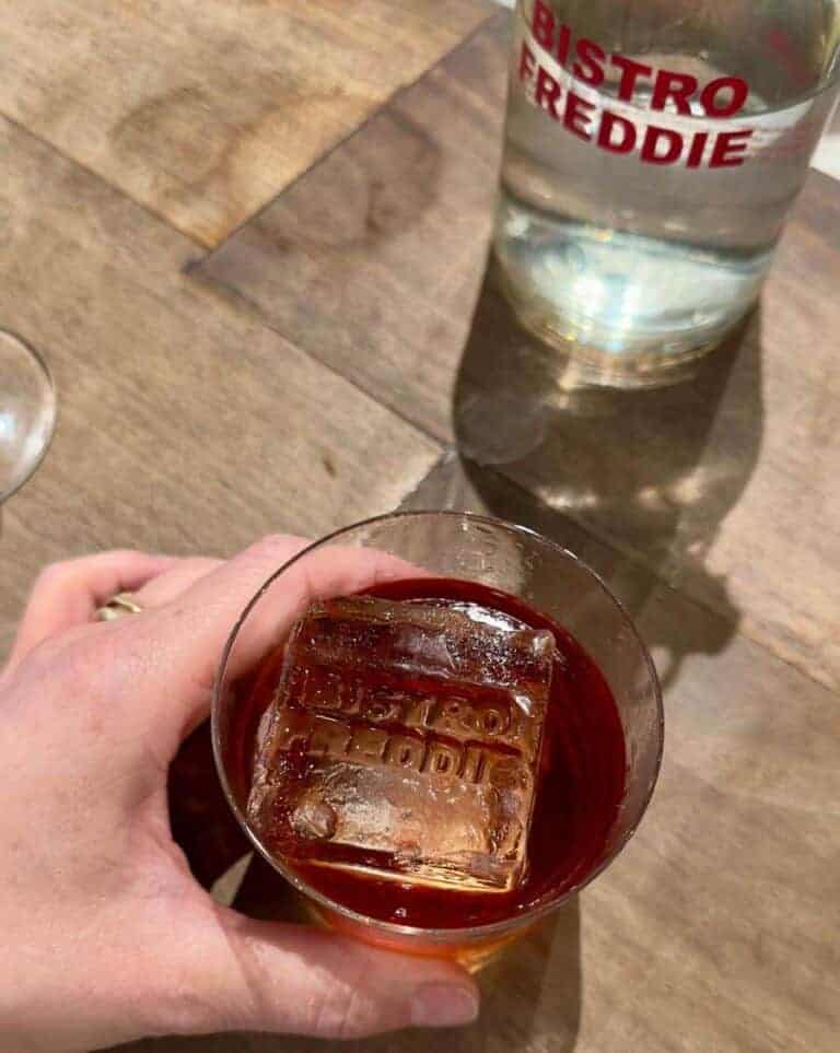 Negroni served at Bistro Freddie with an ice blocked with the restaurant name stamped on it.