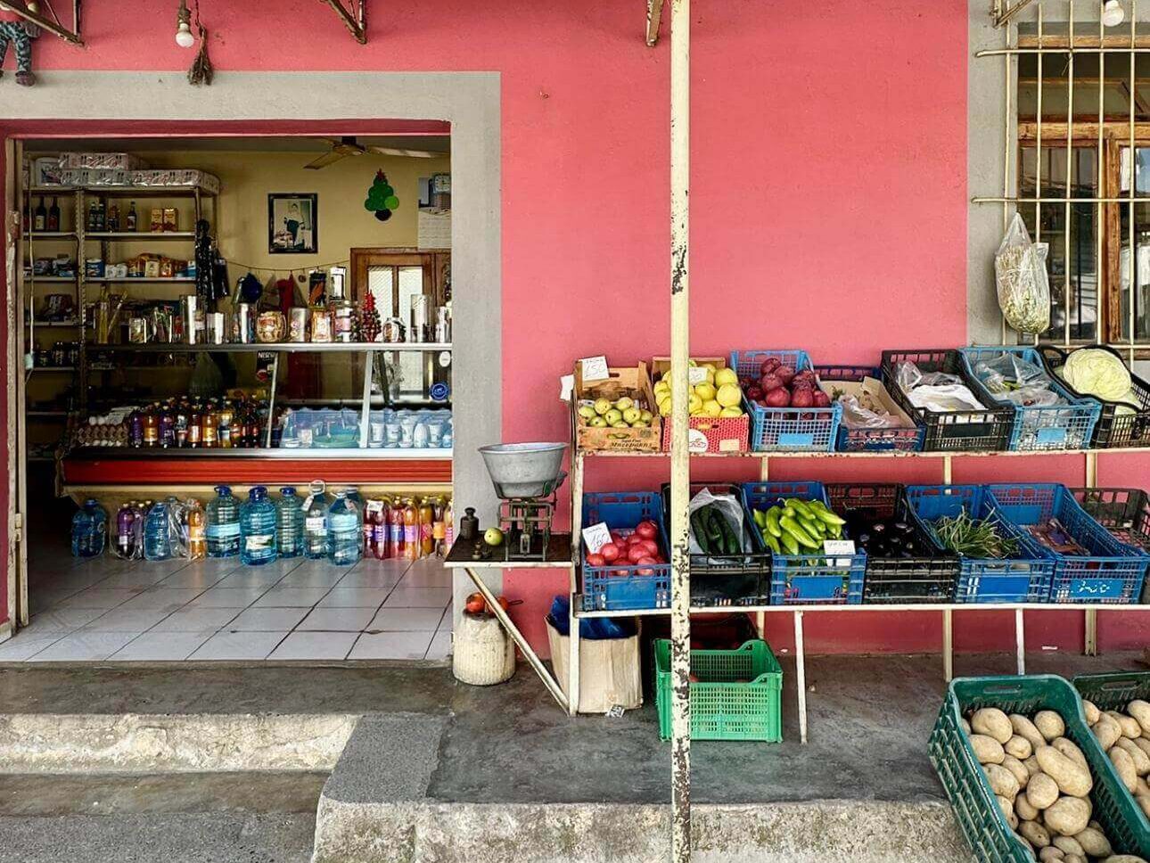 Local grocery store in Elbasan, Albania, selling bottled water and fresh produce